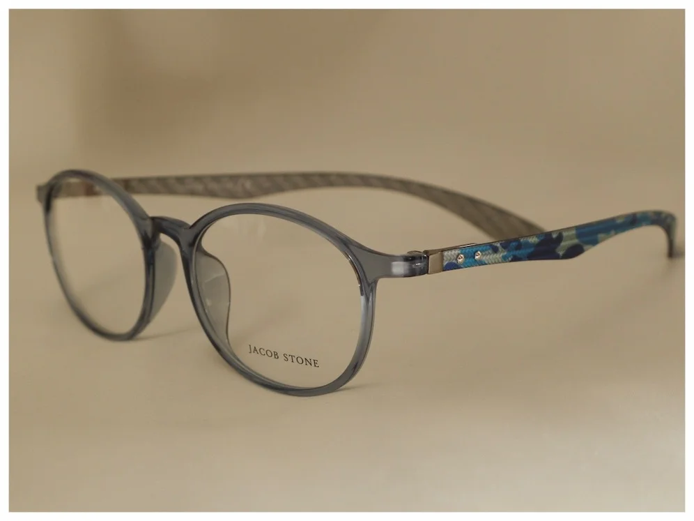 pair of plastic spectacles with blue 'army' style pattern to the temples