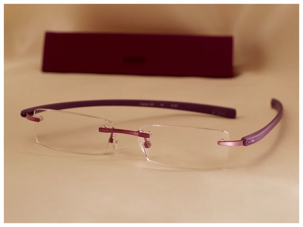 rimless glasses with purple nose-bridge & temples