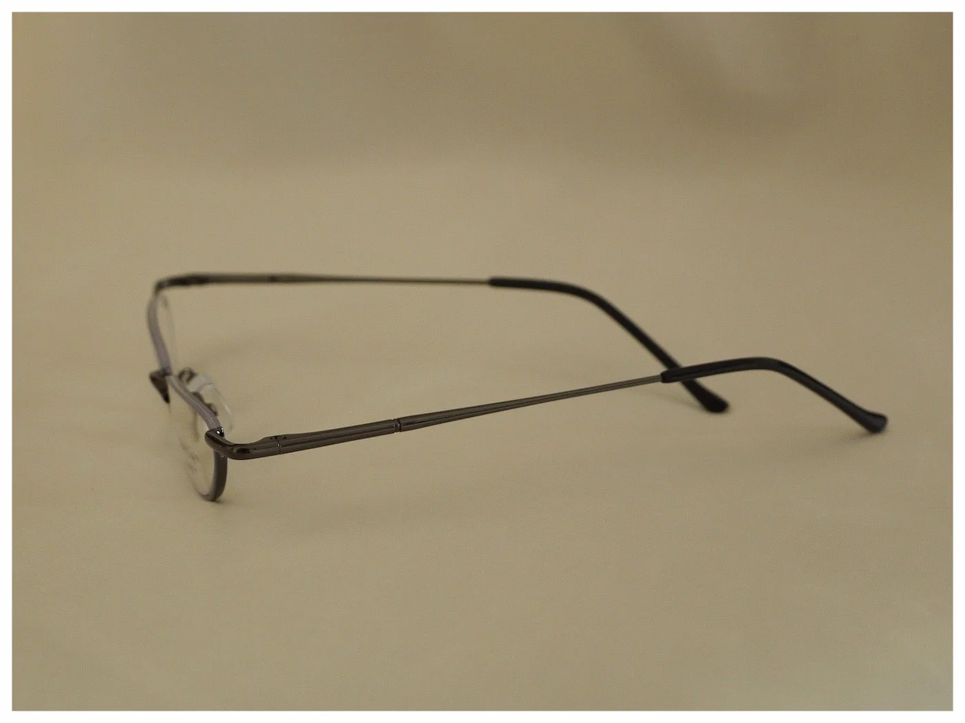 pair of reading glasses in a half-moon shape