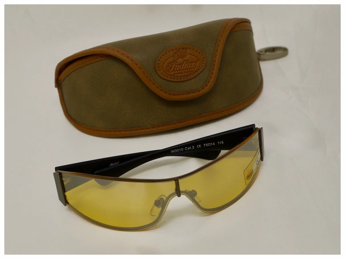 pair of yellow lens sunglasses with case