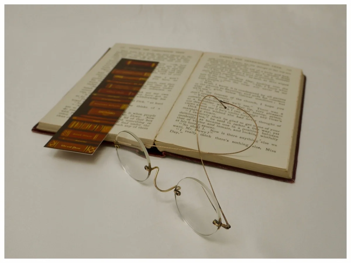 round-eye spectacles with gold bridge and temples