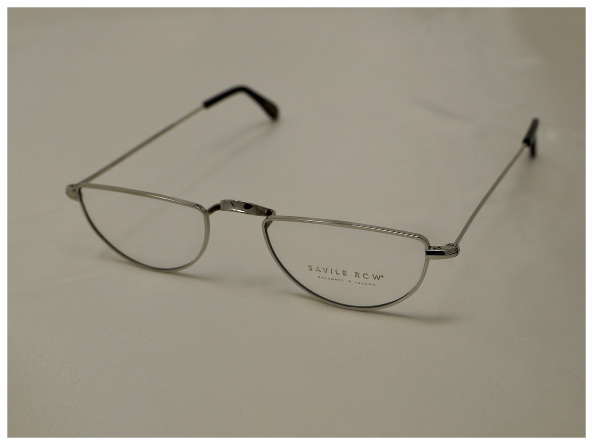 silver coloured, half-eye spectacle frames manufactured in London by Savile Row Eyewear