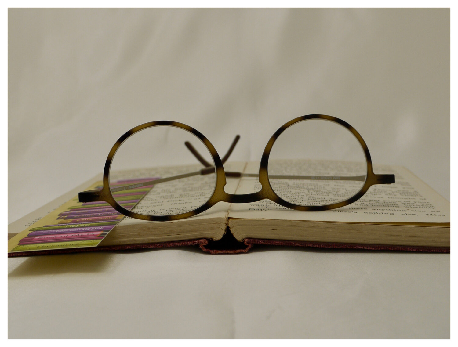 pair of thin reading glasses produced by I Need You