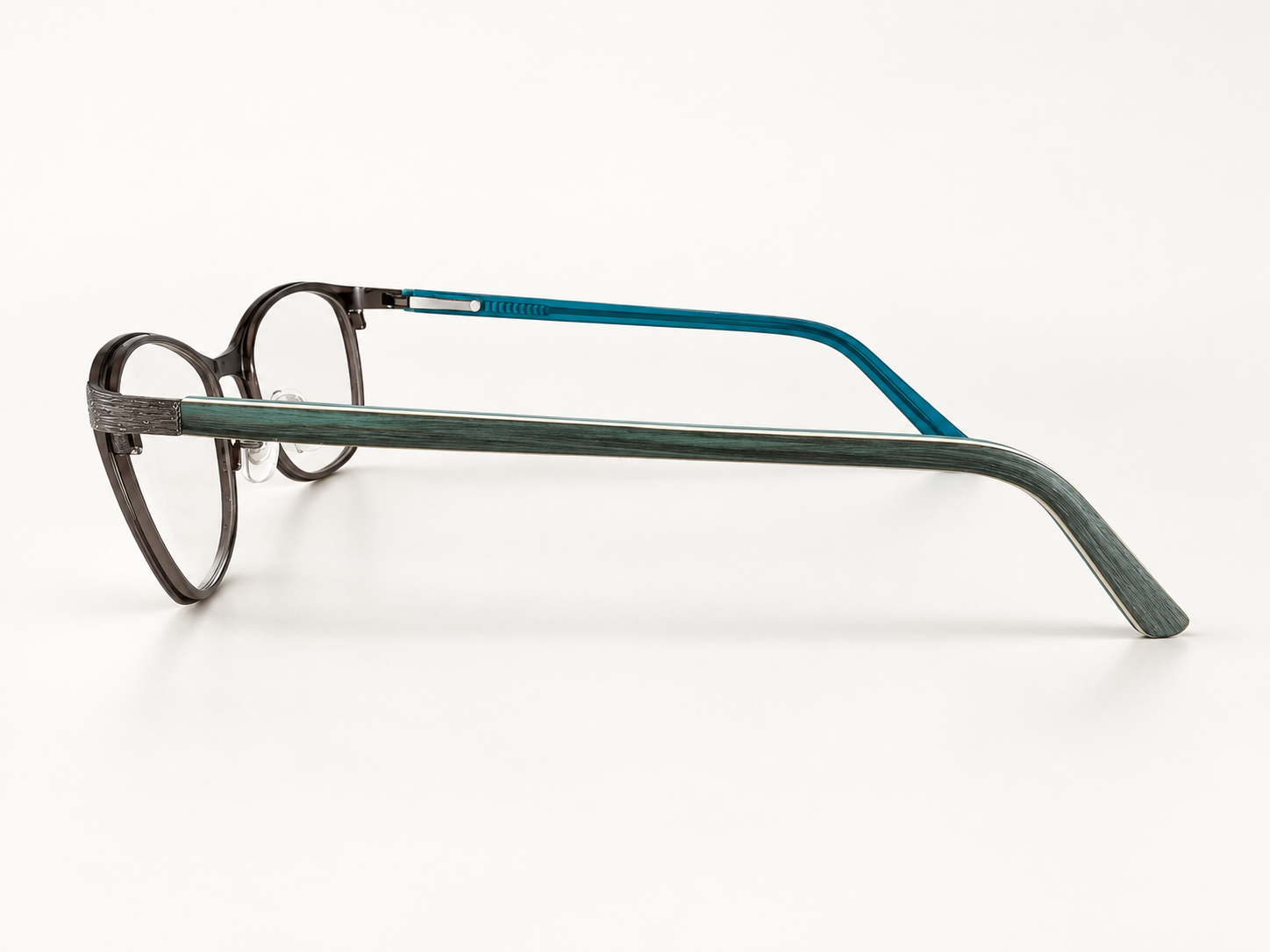 Side view of OMG! 6030 C3 reading glasses showing the textured teal arm