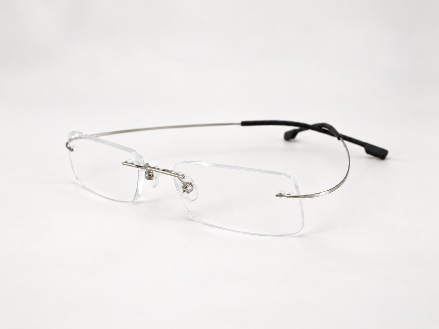 Angled view of FlexiSpex 9946 silver rimless reading glasses
