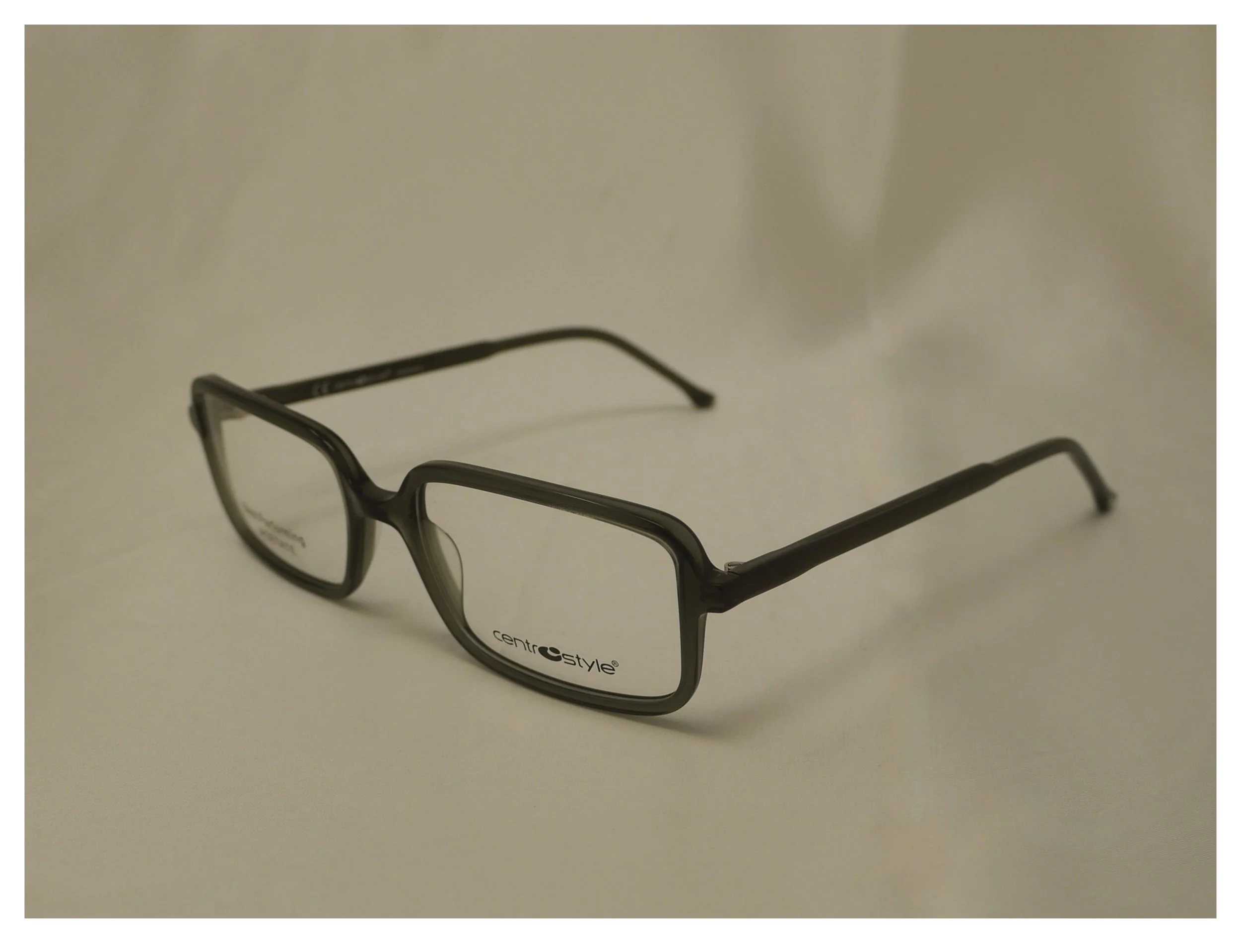 Studio view of the classic F0641 plastic frame in a deep dark green finish