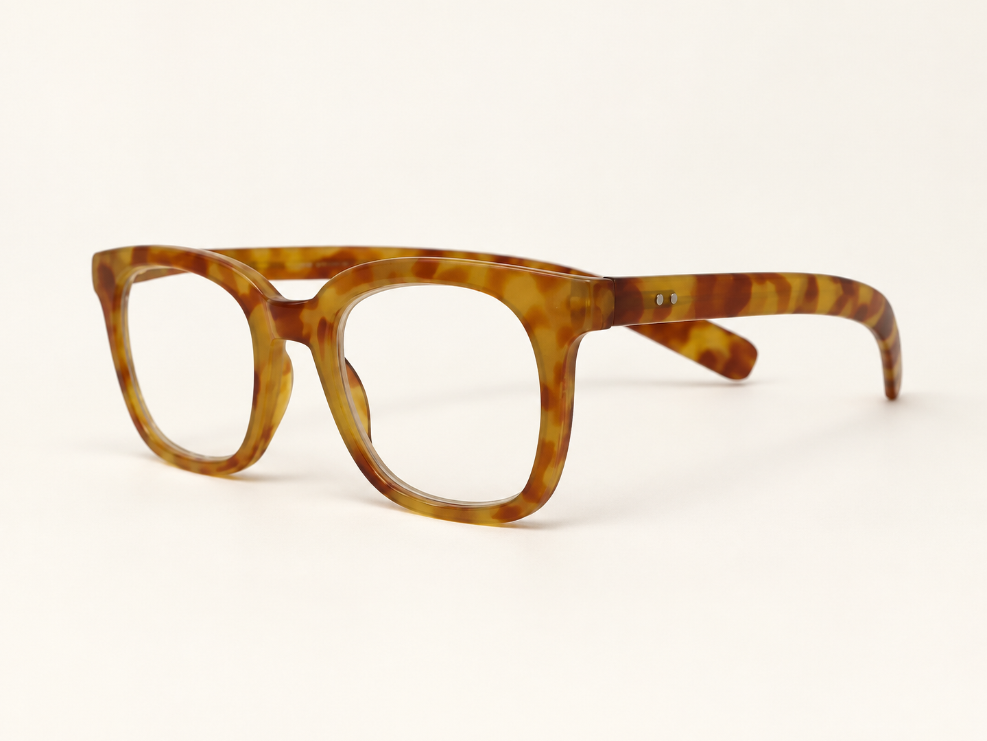 Three-quarter view of I Need You John light Havana reading glasses with spring hinges