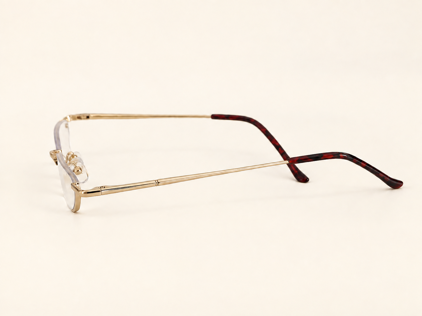 Side view of B-DCHR gold half-eye reading glasses showing the slim temples and burgundy tips
