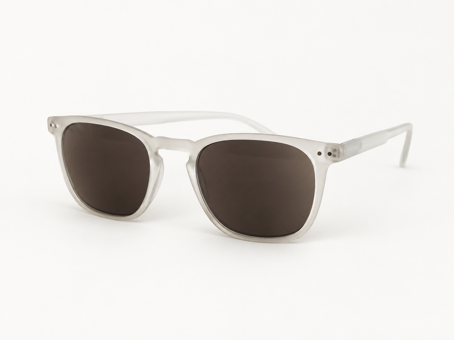 Playa Crystal sun reading glasses with a translucent frame and dark lenses, viewed from the front at an angle