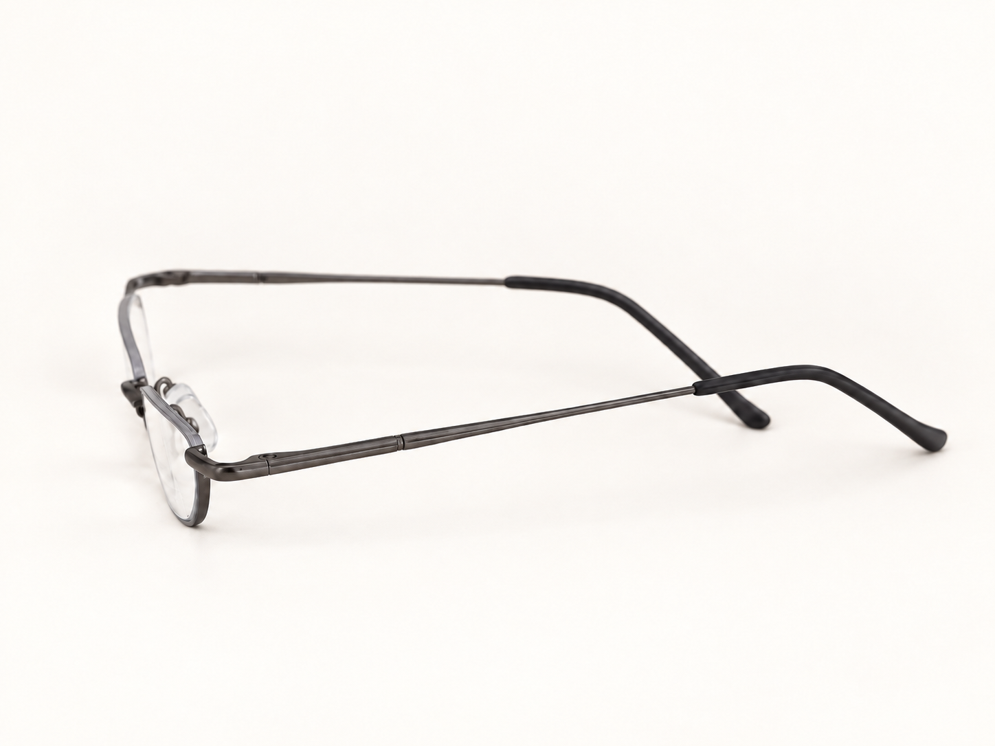 Side view of B-DCHR gunmetal half-eye reading glasses showing the slim metal temples