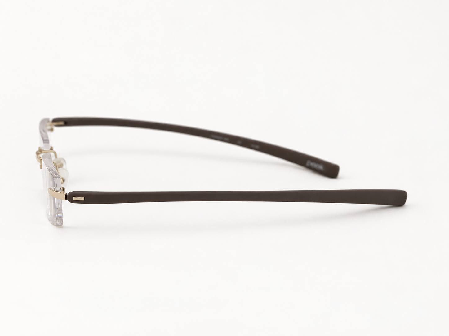Side view of Peek rimless reading glasses showing the slim brown temple and light gold fitting