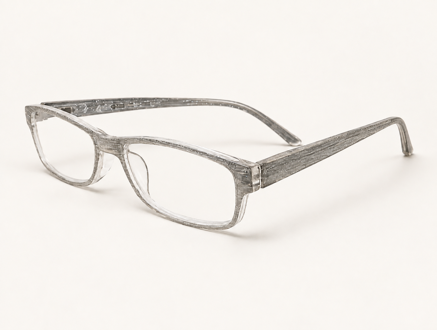 Glamour silver glitter reading glasses shown at a three-quarter angle, with the frame and temples visible against a light grey background