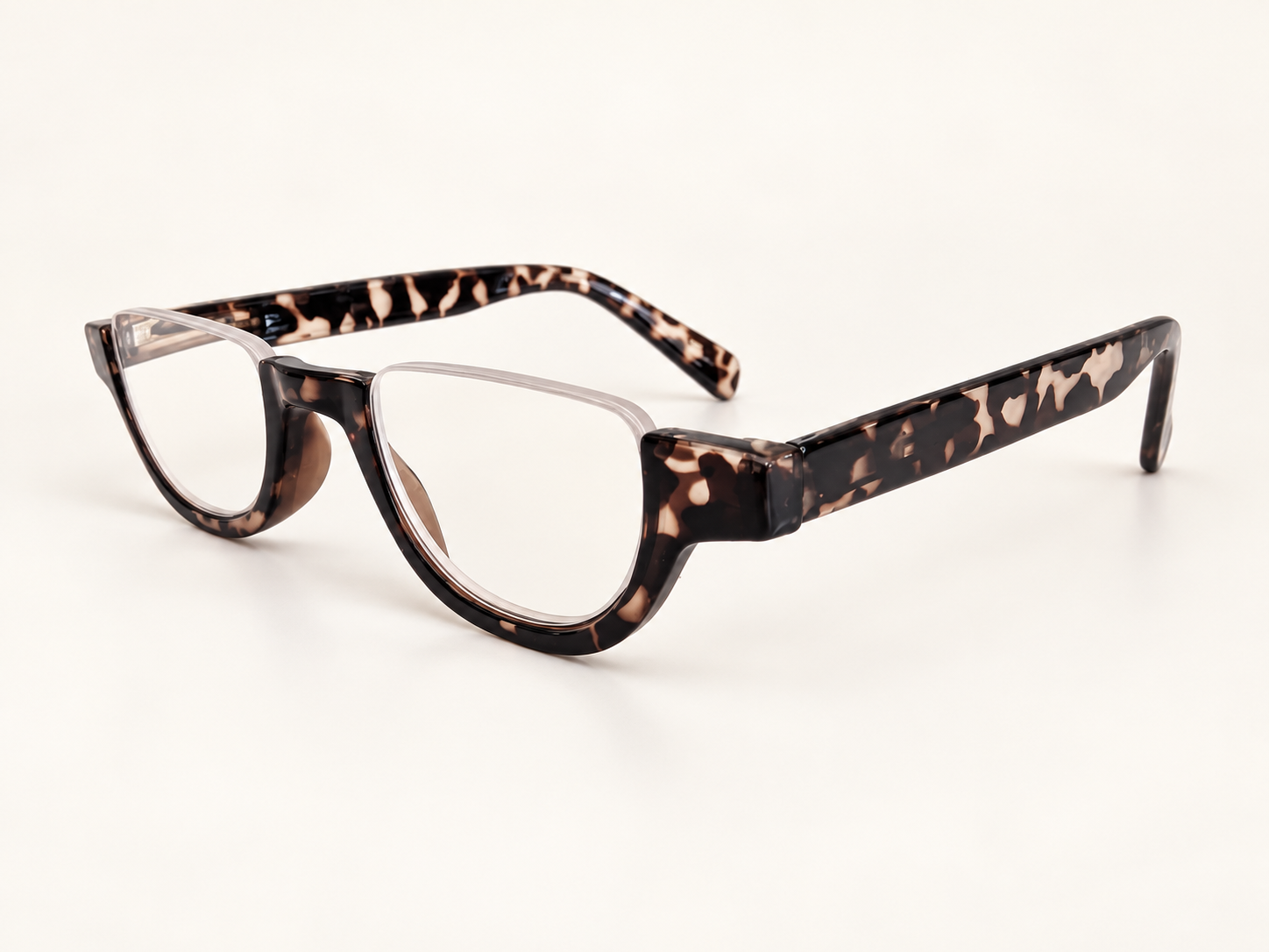 Angled view of Cove tortoiseshell half-eye reading glasses showing the patterned bridge and arms