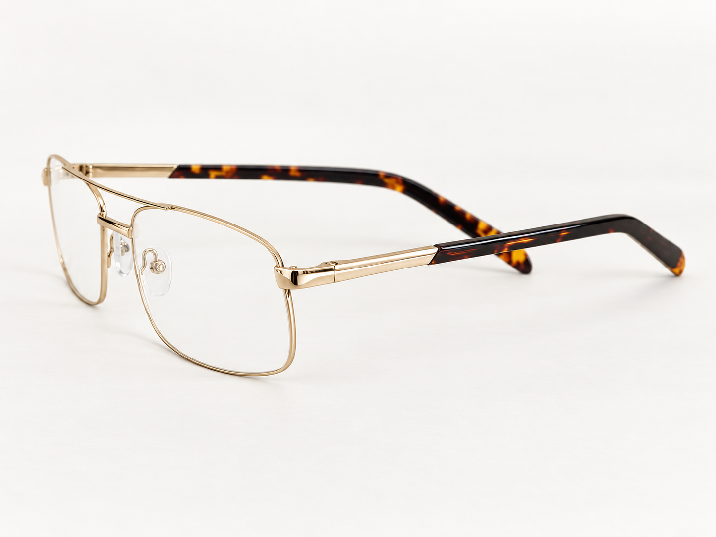 Side view of Okia 9 gold reading glasses showing the hinge and patterned temple tip
