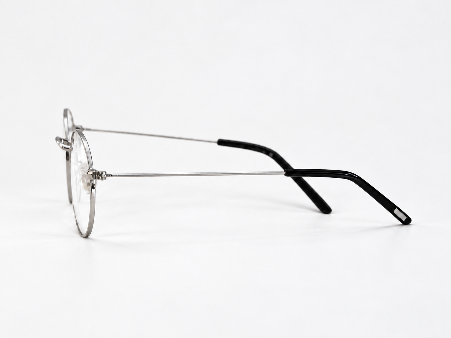 Side view of B-376 silver reading glasses showing the thin metal arm and black temple tip