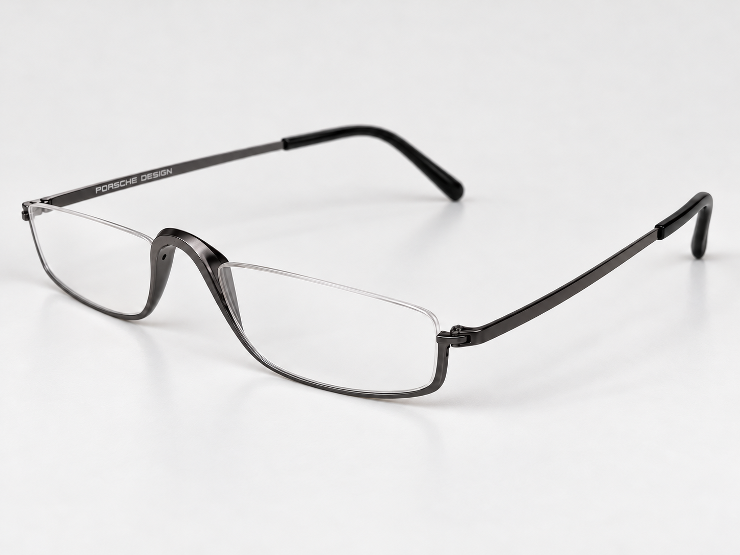 Angled view of Porsche Design P8002-C gunmetal reading glasses showing the sculpted bridge and slim arms