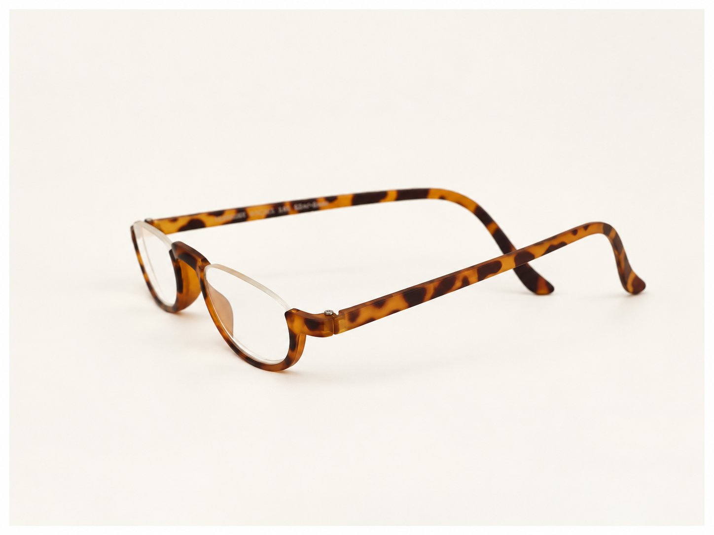 Side view of Vermont tortoiseshell half-eye reading glasses showing the slim temples
