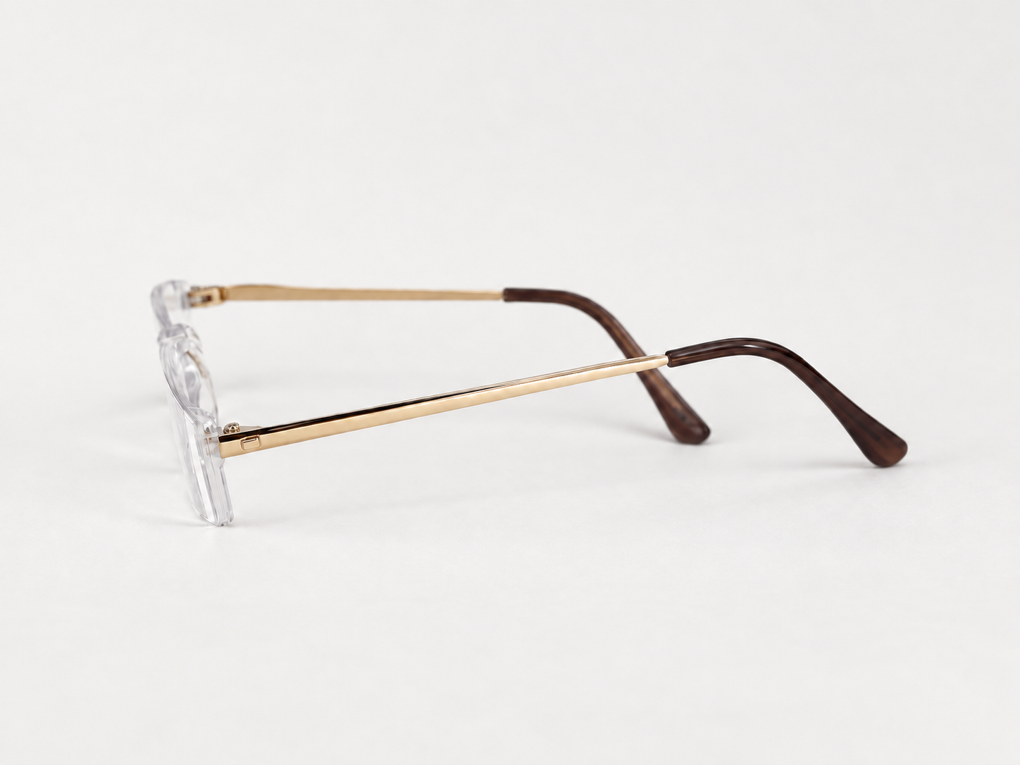 Side view of C2200 rimless reading glasses with gold-coloured arms