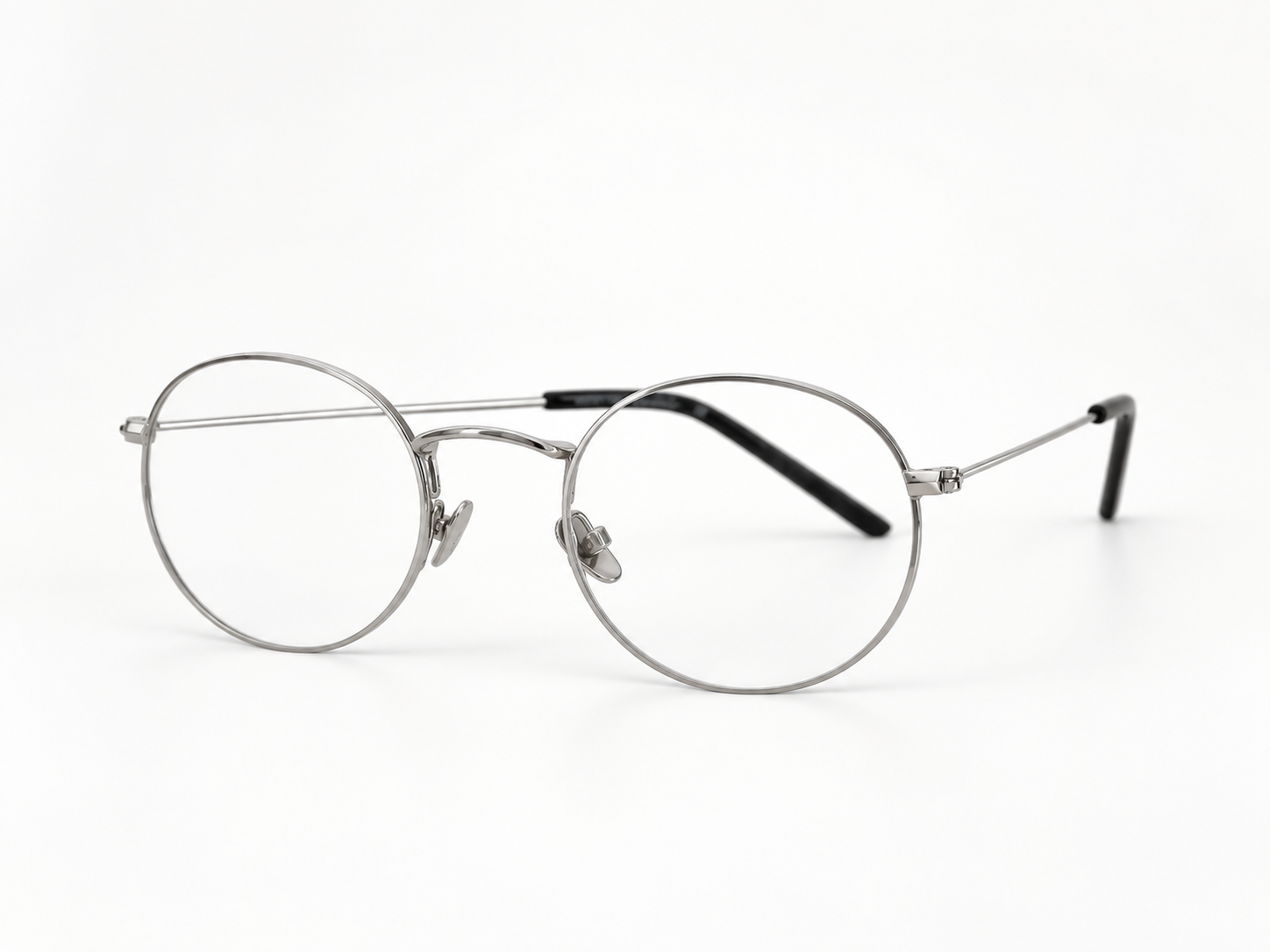 Angled front view of B-376 silver round reading glasses with adjustable nose pads