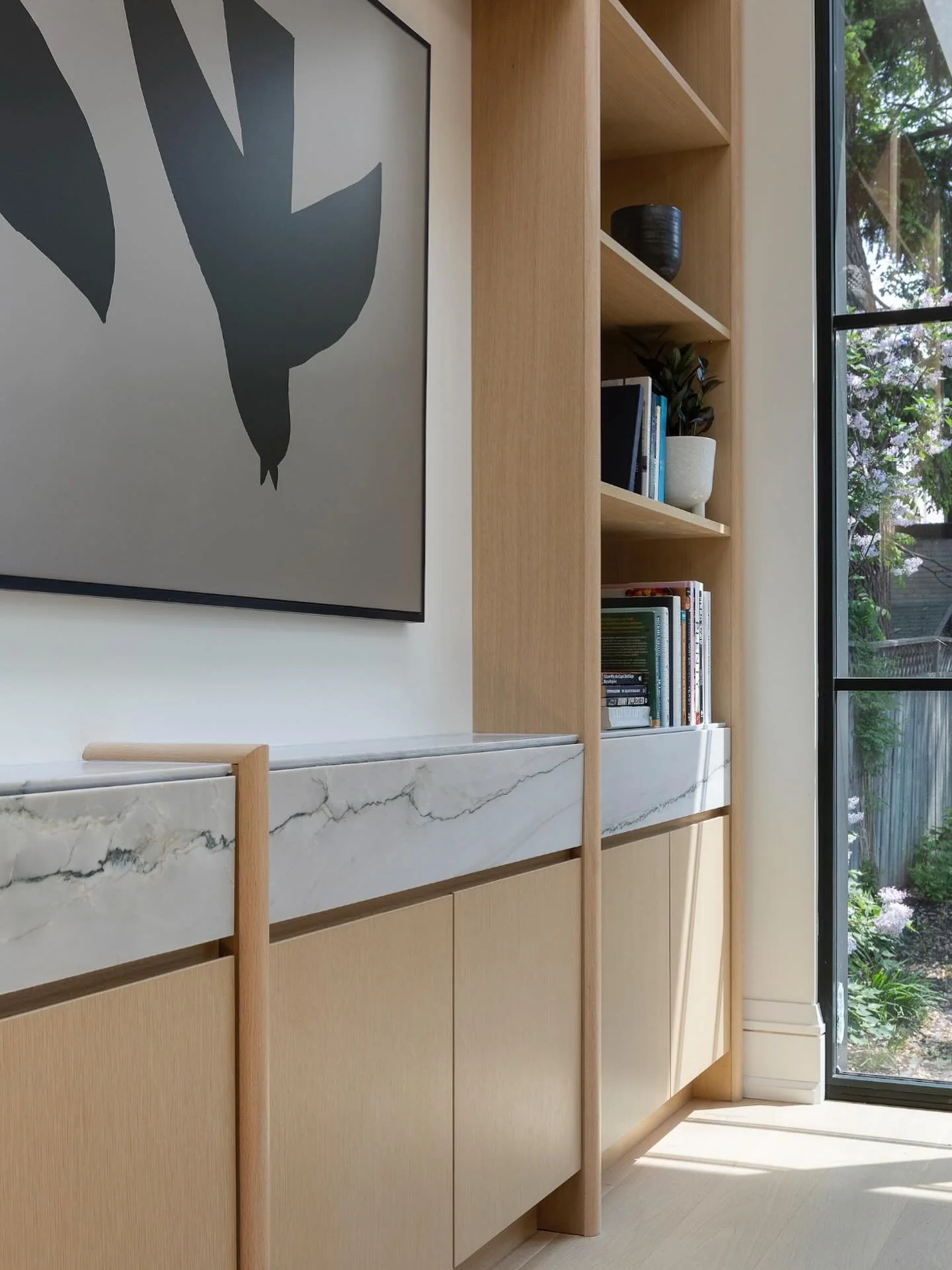 Design is in the details! This family room&rsquo;s millwork features rounded white oak profiles and drawers seamlessly hidden behind mitred stone cladding.

Photography @kielyramosphoto 
Architecture @drolehouse 

#torontodesigner #torontointeriordes