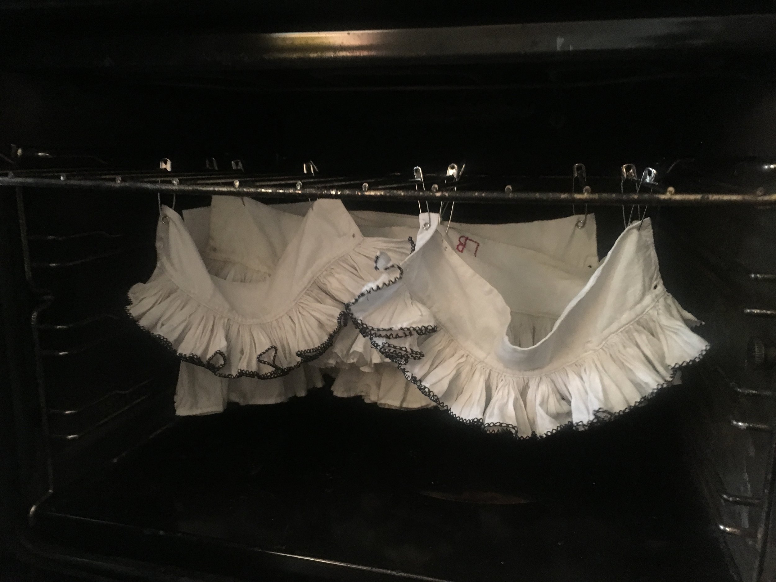 Freshly starched ruffs (made by my class with two examples from The School's collection) drying in the oven at The School of Historical Dress