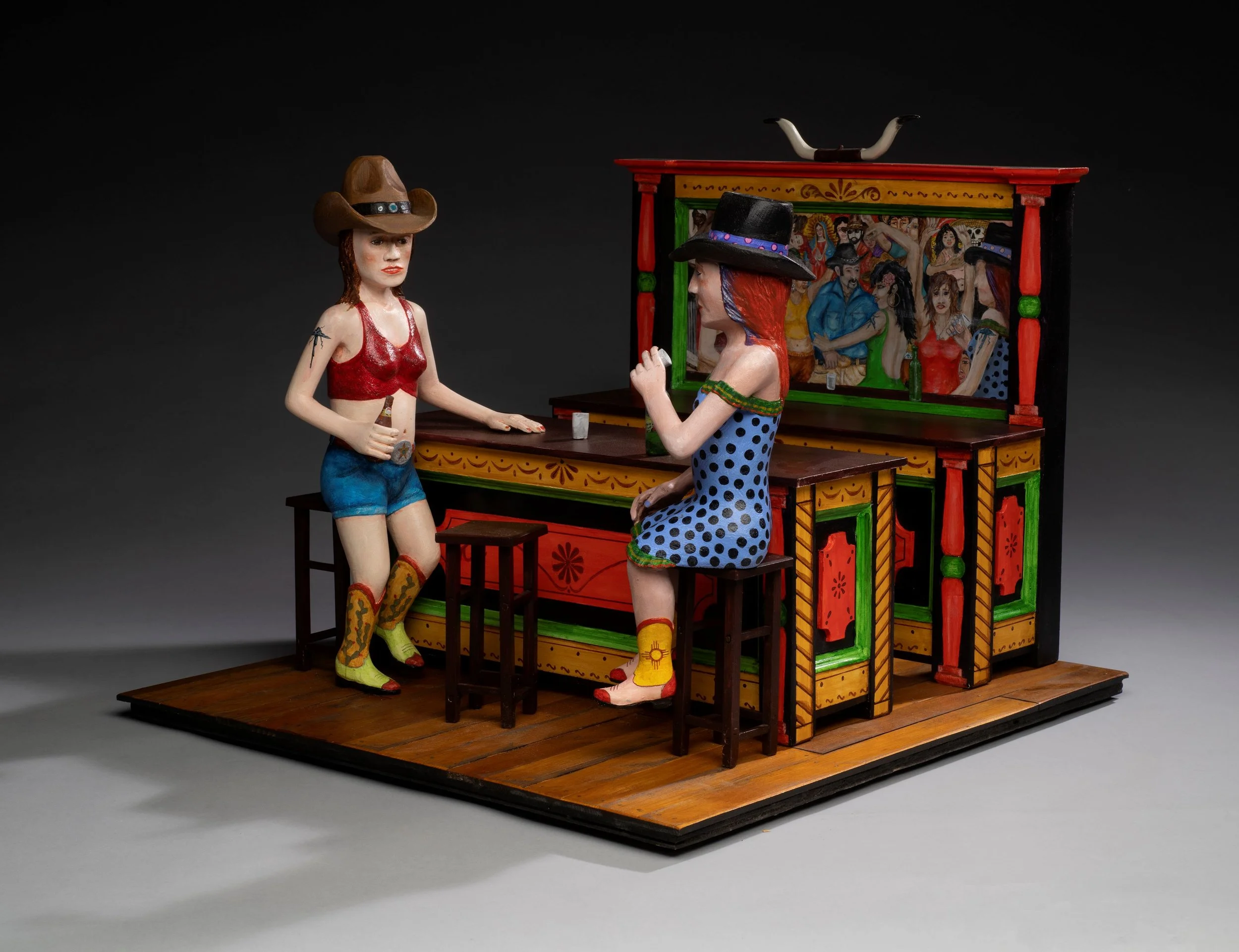   Honky Tonk Graces , 2023. Carved and painted wood, 17 ¾ x 21 ⅝ x 22 in. Collection of Curt, Christina, and Jonah Nonomaque. Photo © James Hart. 