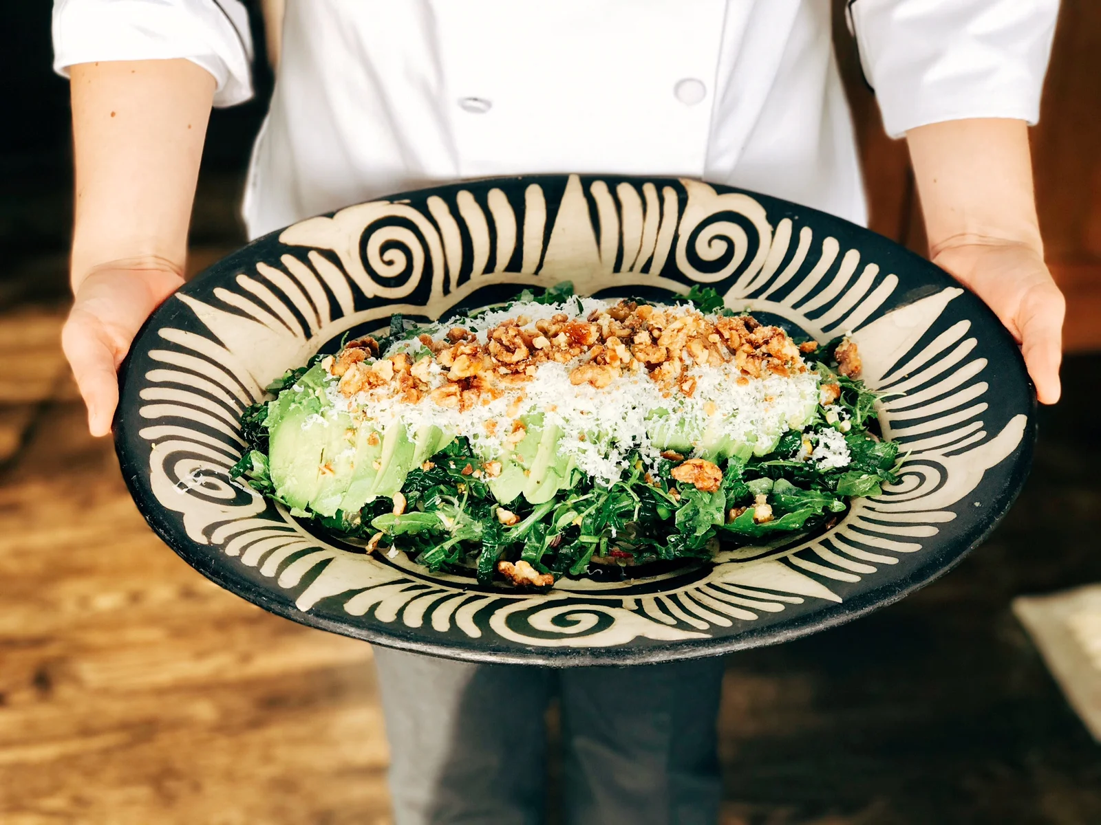 Salad of arugula, kale, charred corn, candied walnuts, avocado, fennel, manchego and lemon