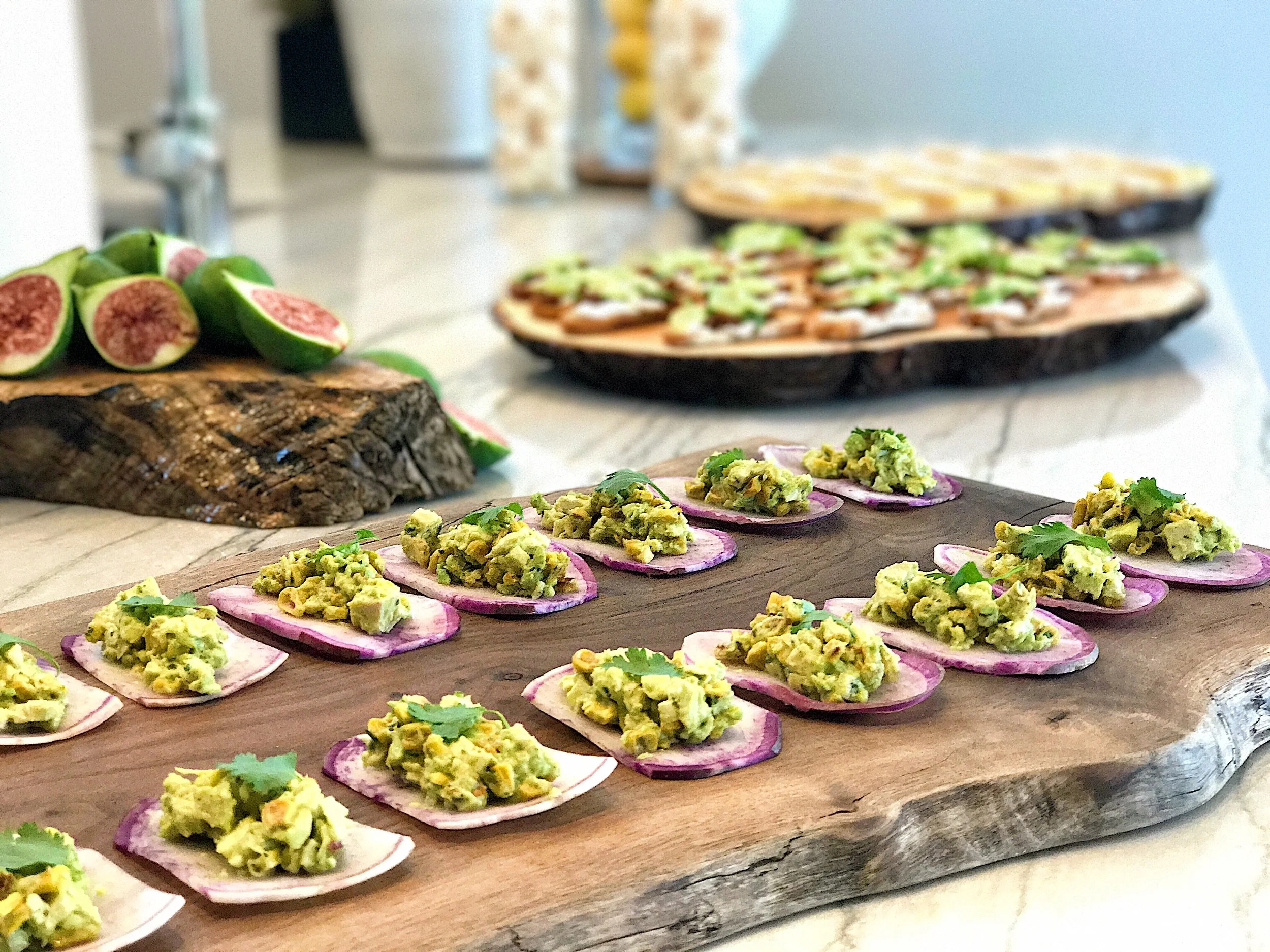 Avocado, chicken, corn, cilantro and lime on radish