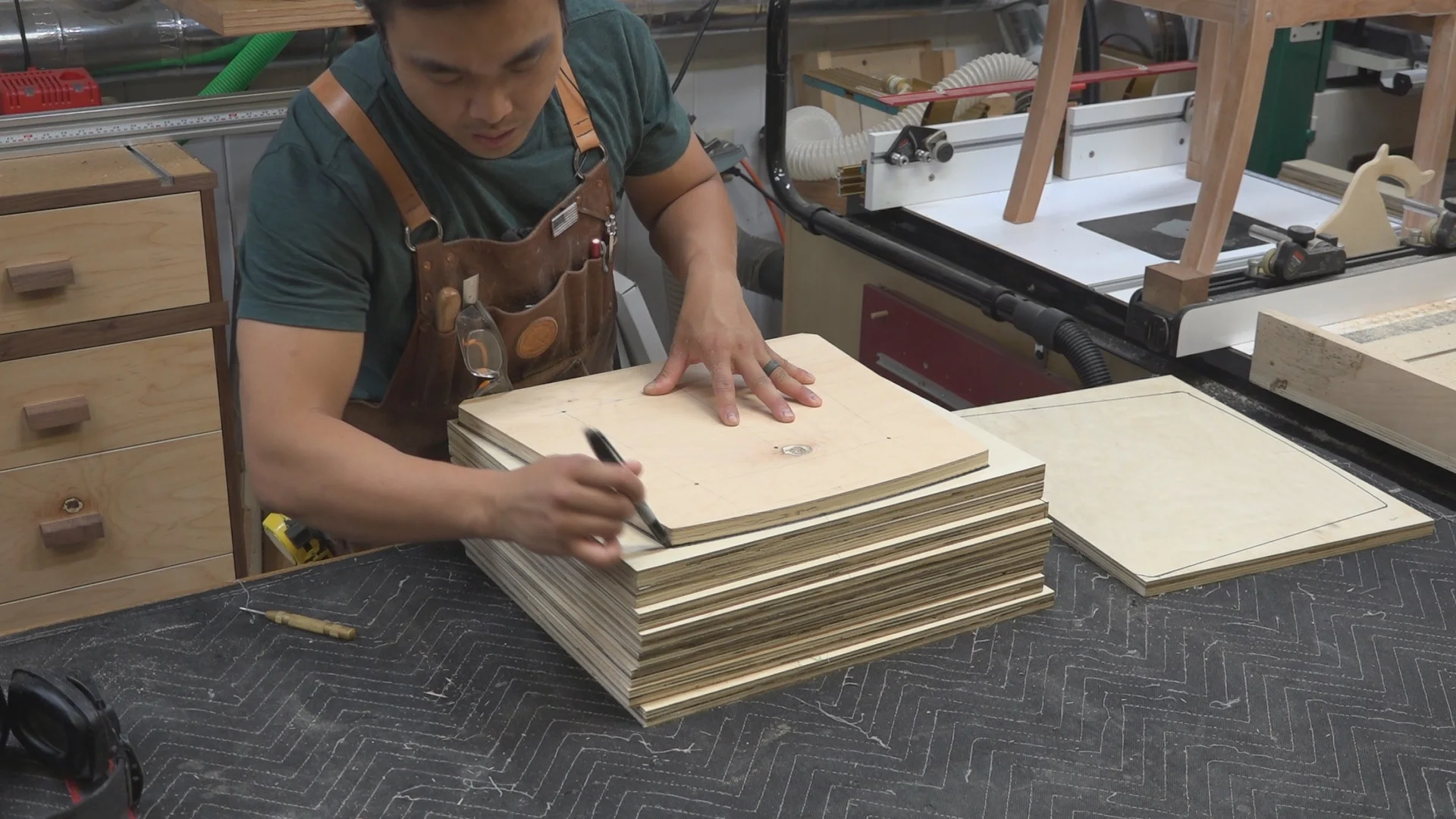 Tracing the outline of the chair insert template.