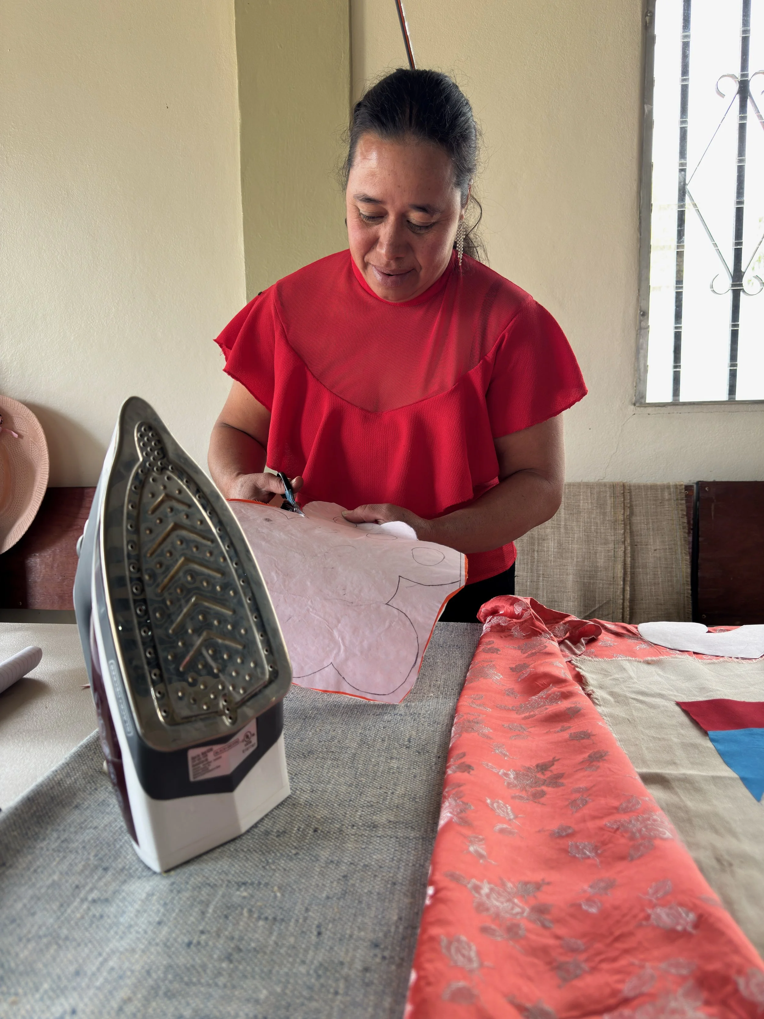 Honduran woman cutting stencil