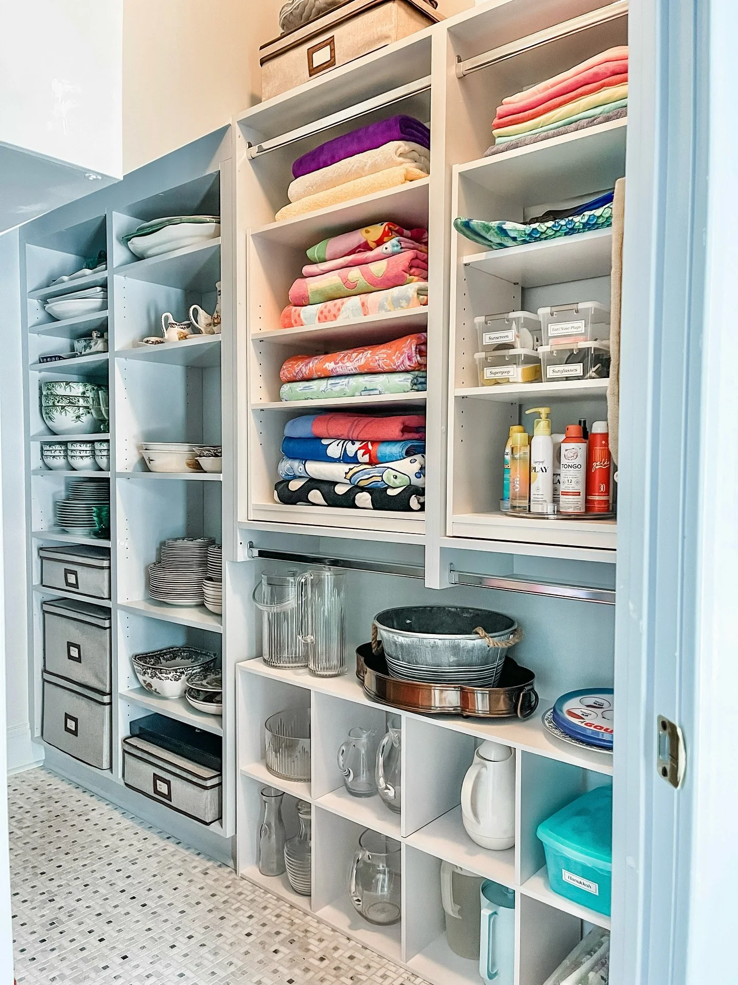 Affordable solutions with a custom feel!

This closet was designed with space to hang clothes. However, this client needed this to be a place to store serving items and pool supplies. By adding in some affordable free standing solutions, we were able