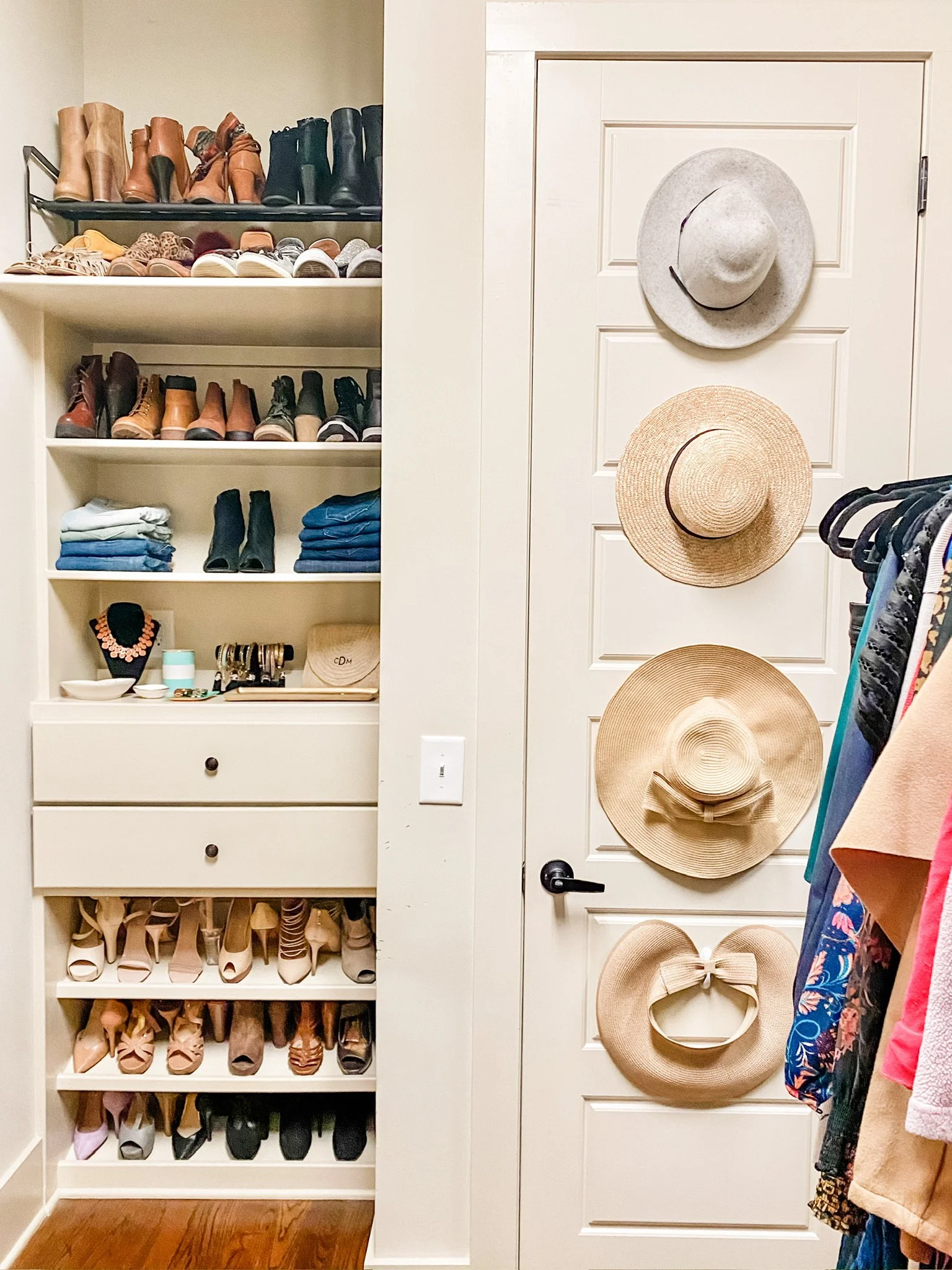  Hat storage designed on back of closet door using command medium utility hooks 