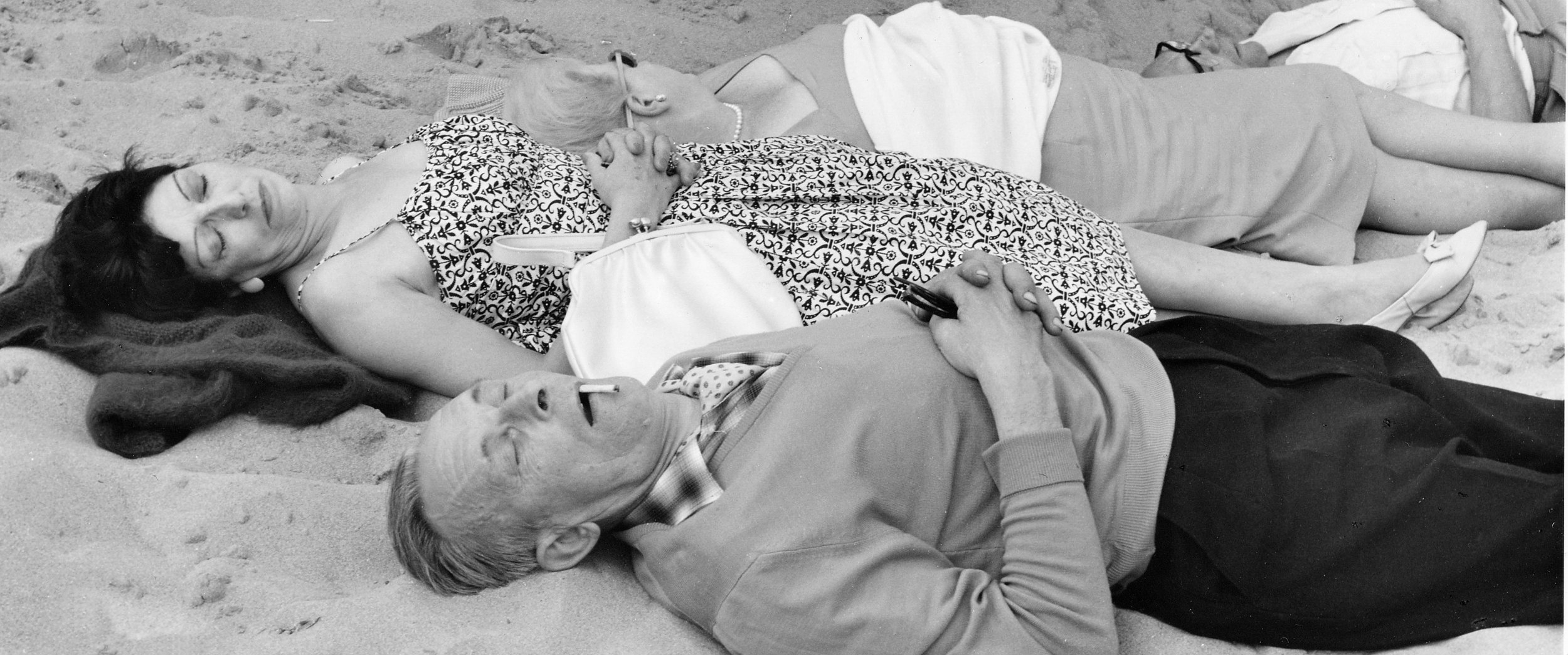 2 couples asleep on beach, 15-98-2 (1961).jpg