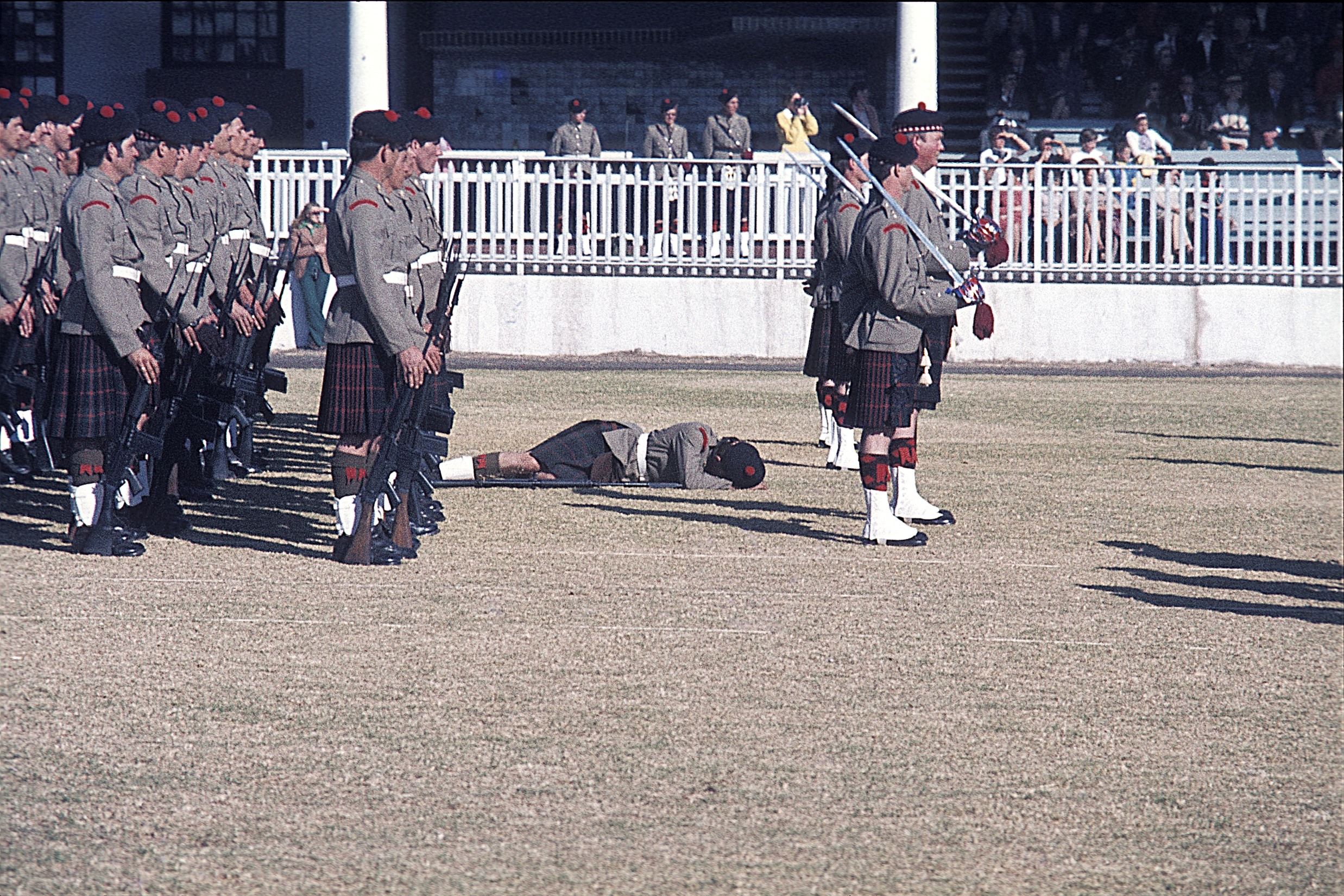 Pipe Band at a Highland Gathering-- poor guy keeled right over in the heat.