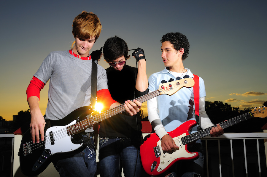 Young musicians posing with instruments
