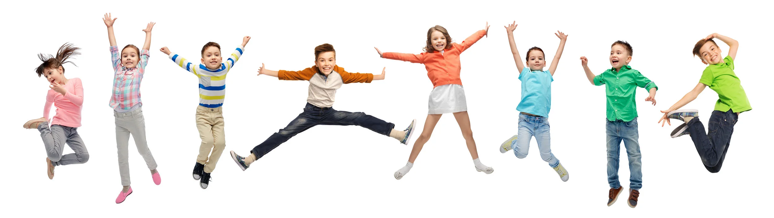 happiness, childhood, freedom, movement and people concept - happy kids jumping in air over white background