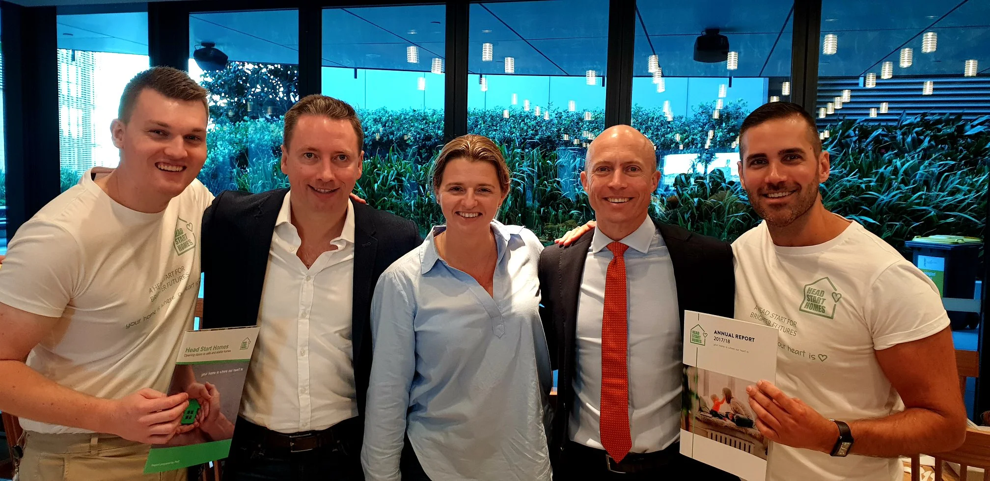 Joel (far left) and Stephen, Head Start Homes Founder (far right) hosting a recent fundraiser attended by over 100 Westpac staff.