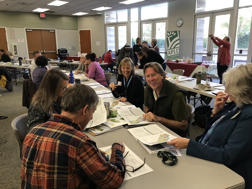 Some Sacramento District Members Enjoying How to Determine Reference Evapotranspiration Zone for Location in Group Exercise. Photo Cheryl Buckwalter.