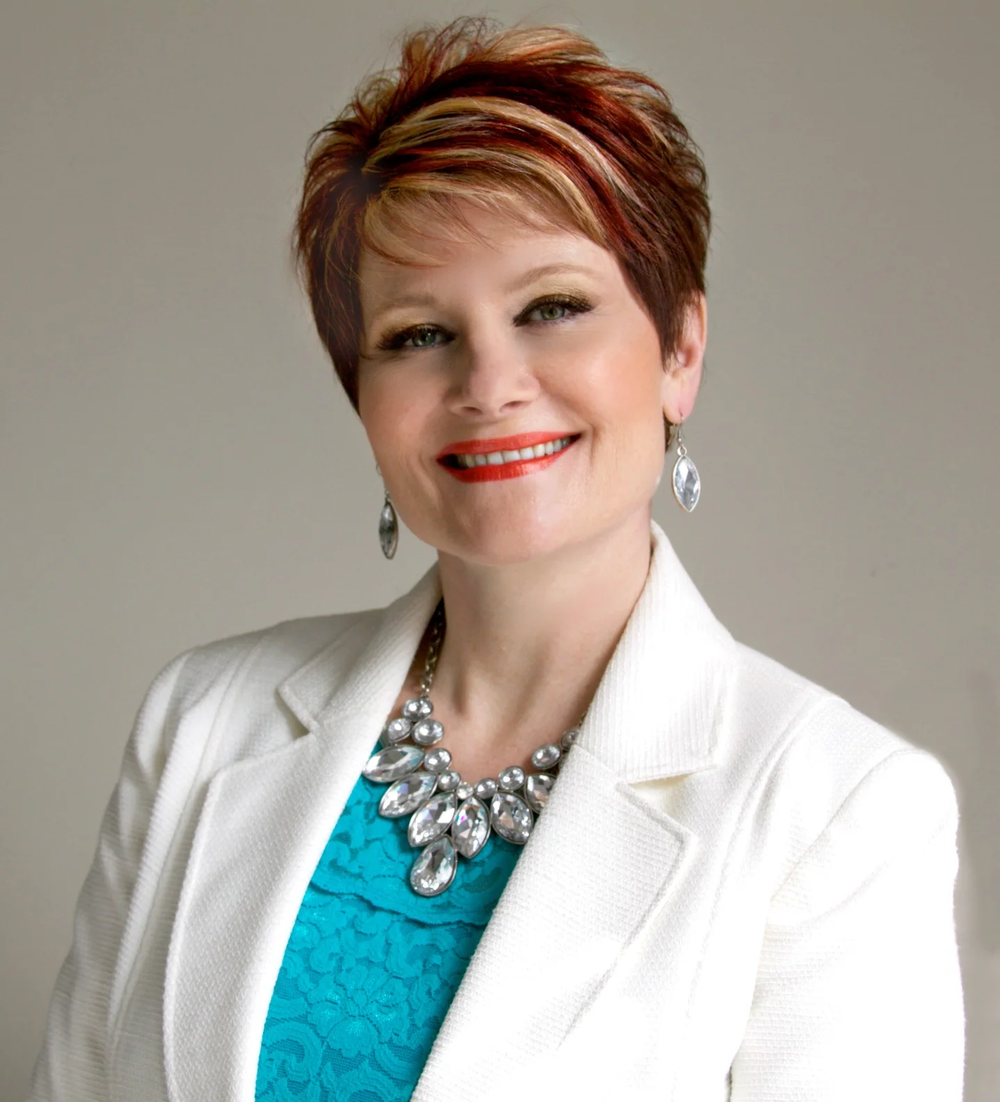 ReAnn Ring headshot white jacket blue blouse jewels.jpg