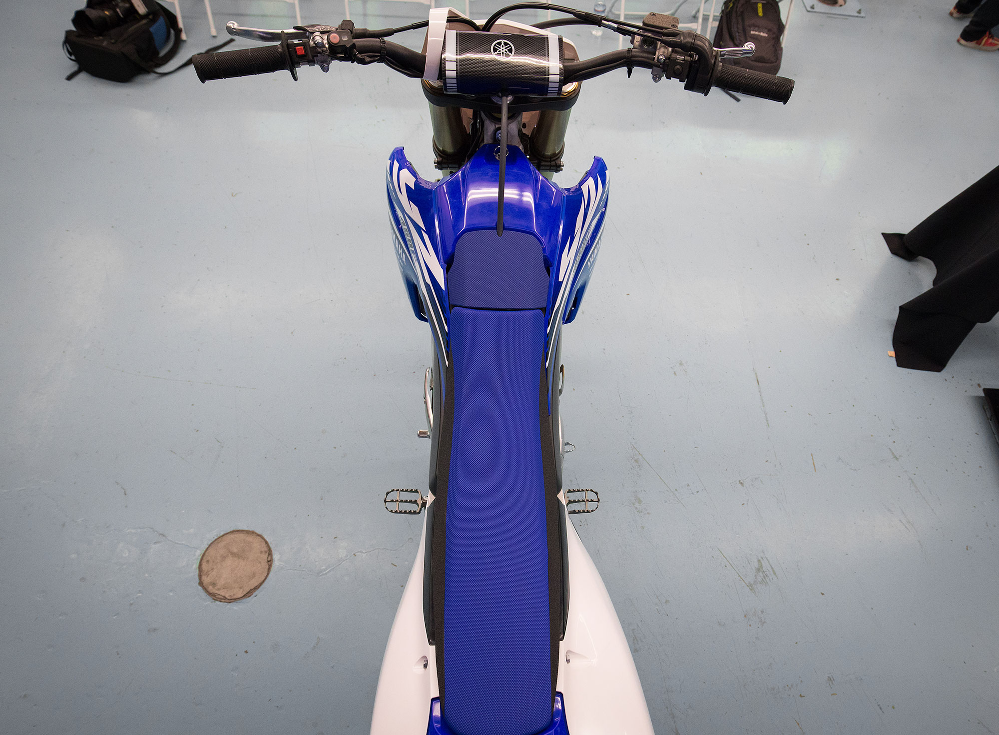 Staring down at the seat/tank/handlebar/shroud area on the new blue machine. 