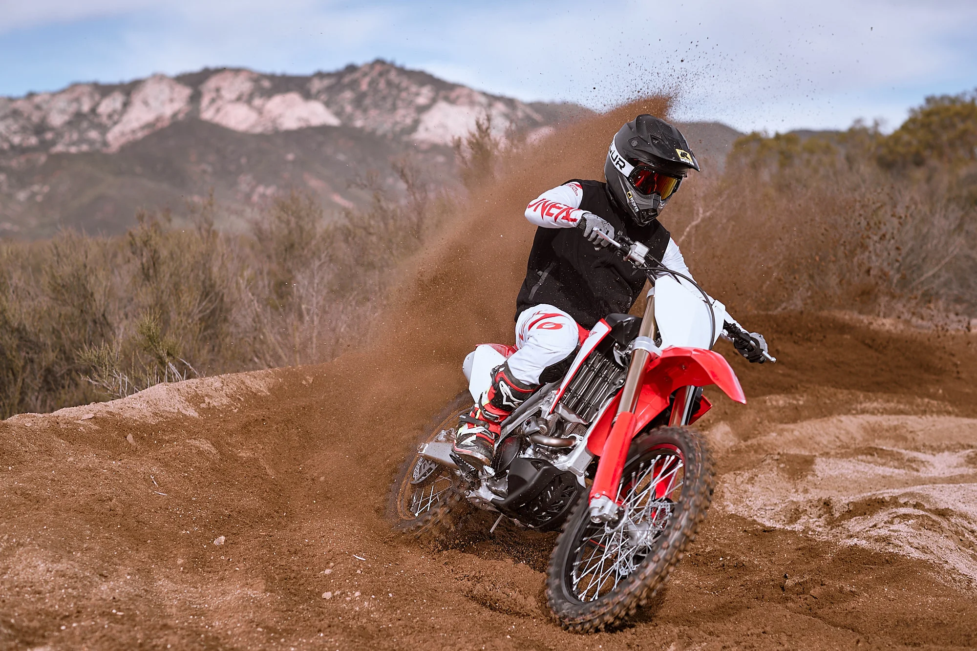 The Honda loves to carve up some berms.