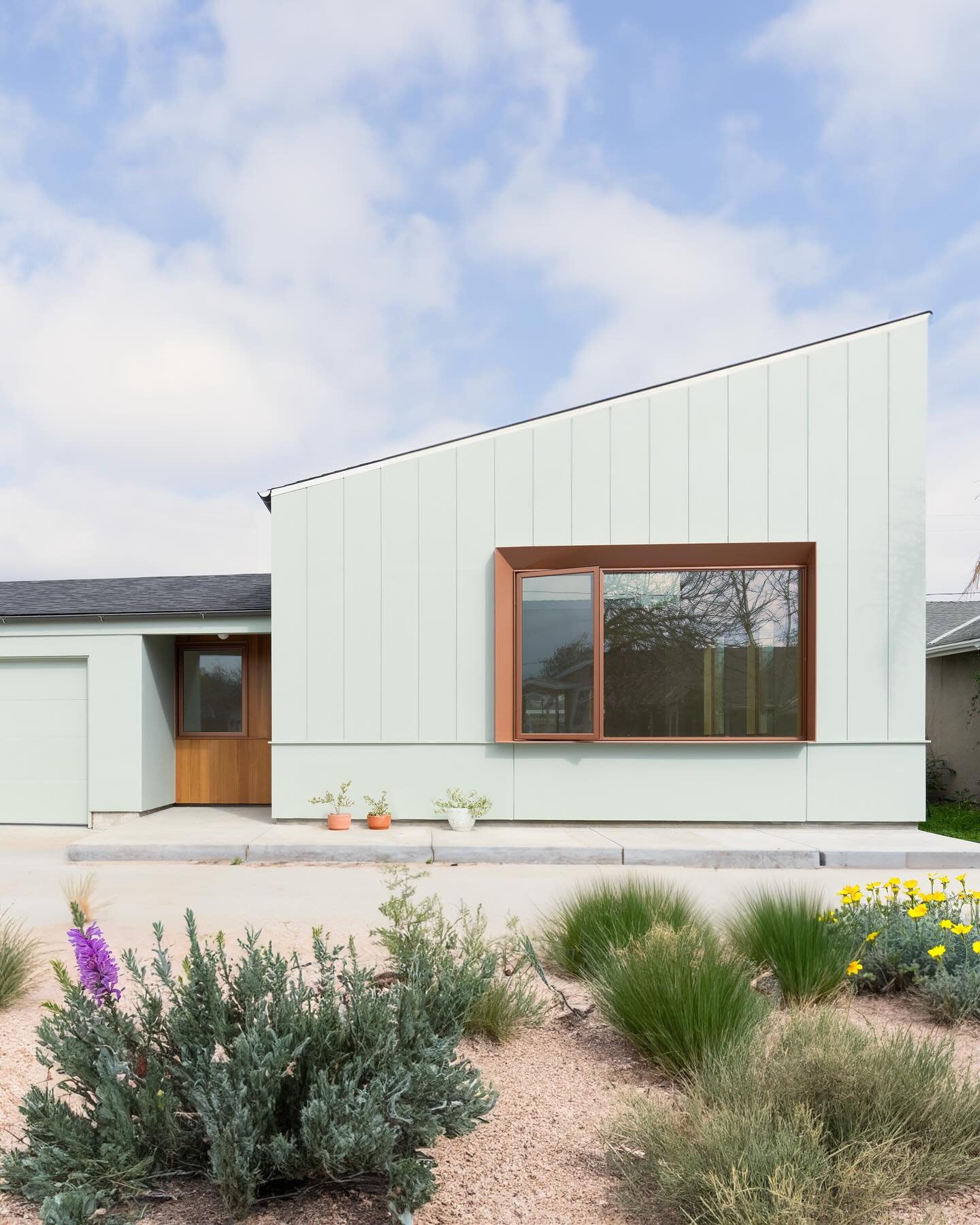 The house had to grow for a growing family&mdash;
Space for music, a cozy window to read by, and light to fill their days.

This new addition brings it all: more height, more sky, and a quiet spot to pause.
Clean, simple lines shape the exterior, ble