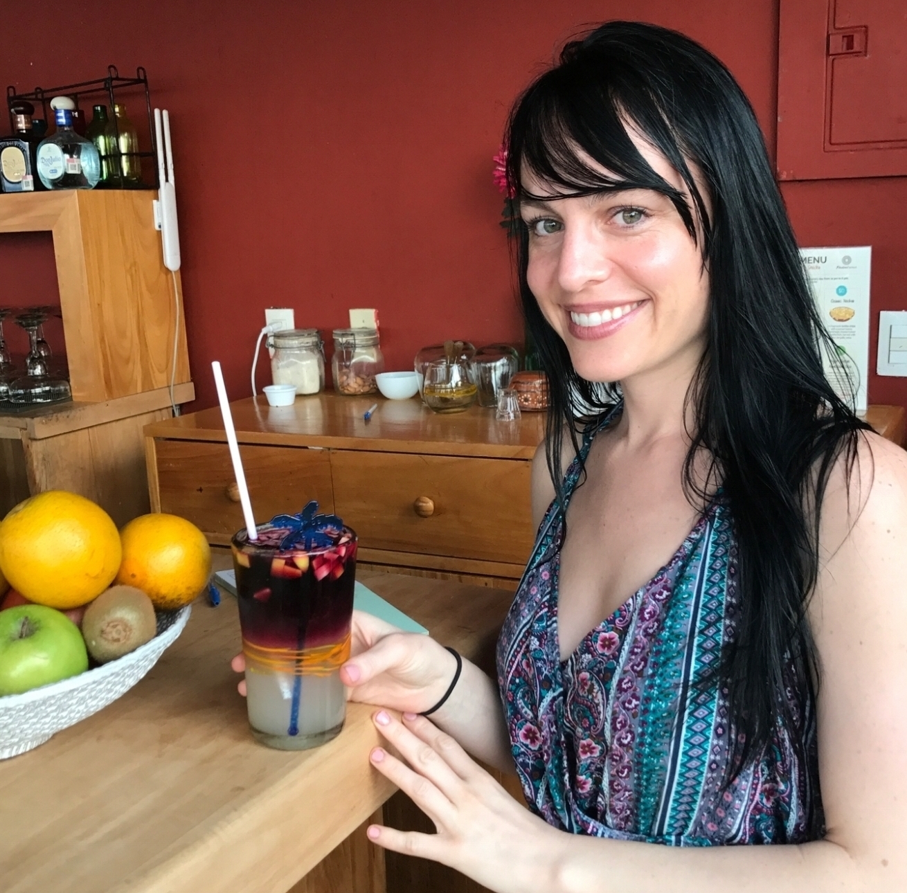  Colleen enjoying their delicious red sangria with fresh fruit and herbs. 
