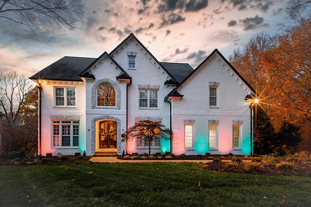 Don Evans Photography in Greensboro NC Real Estate Photography twilight shot of a white brick house.jpg