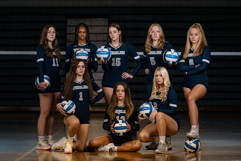 Don Evans Sports Photography in Greensboro NC high school senior volleyball players pose for a cool team photo during their senior sports portraits