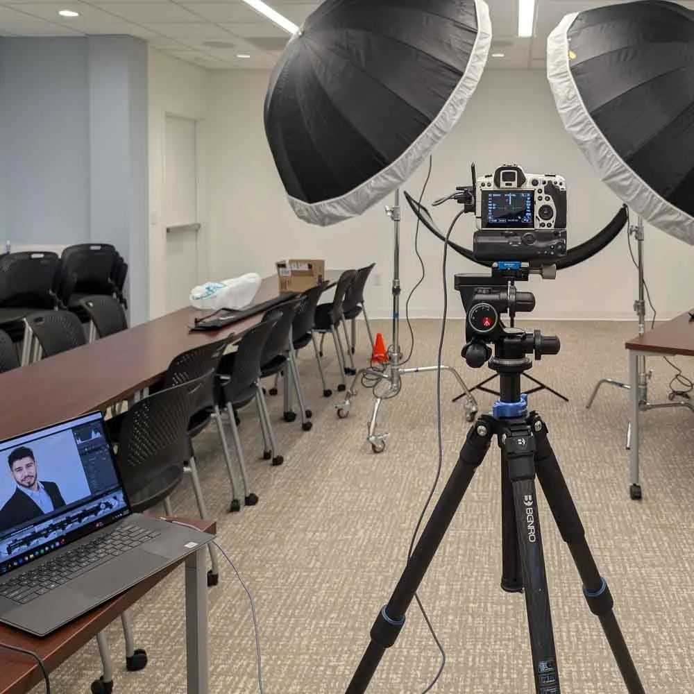 On-site corporate headshot booth setup in Greensboro NC showing efficient workflow for high-volume employee portraits