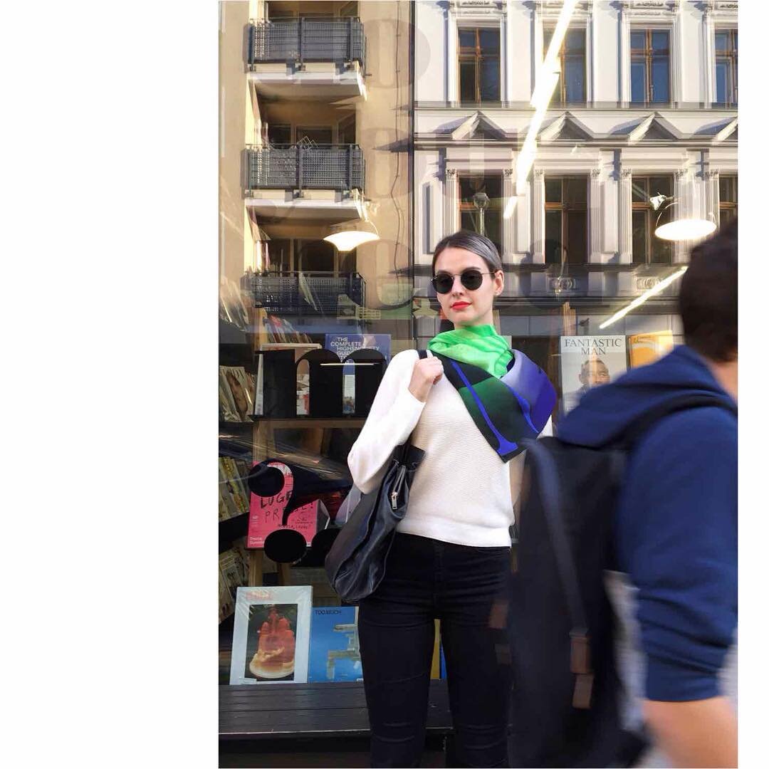 digital printed silk scarf Aurora as seen outside of @doyoureadme_berlin 
This hand rolled hem 100% silk scarf features a contemporary graphic aesthetic design in a fresh colour combo of neon green, light purple, gradience navy and gradience dark gre