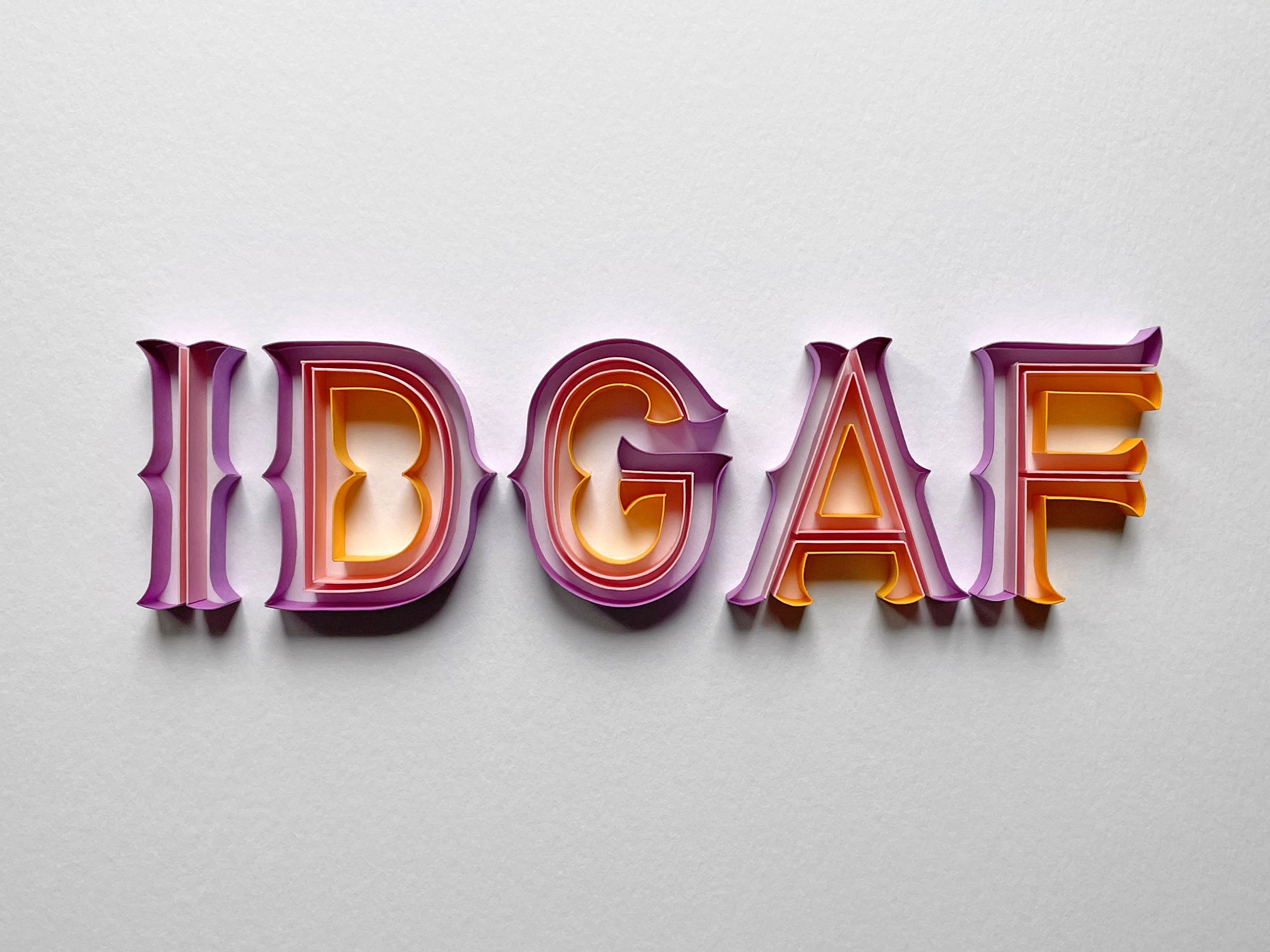 Typography original on-edge paper art - IDGAF acronym