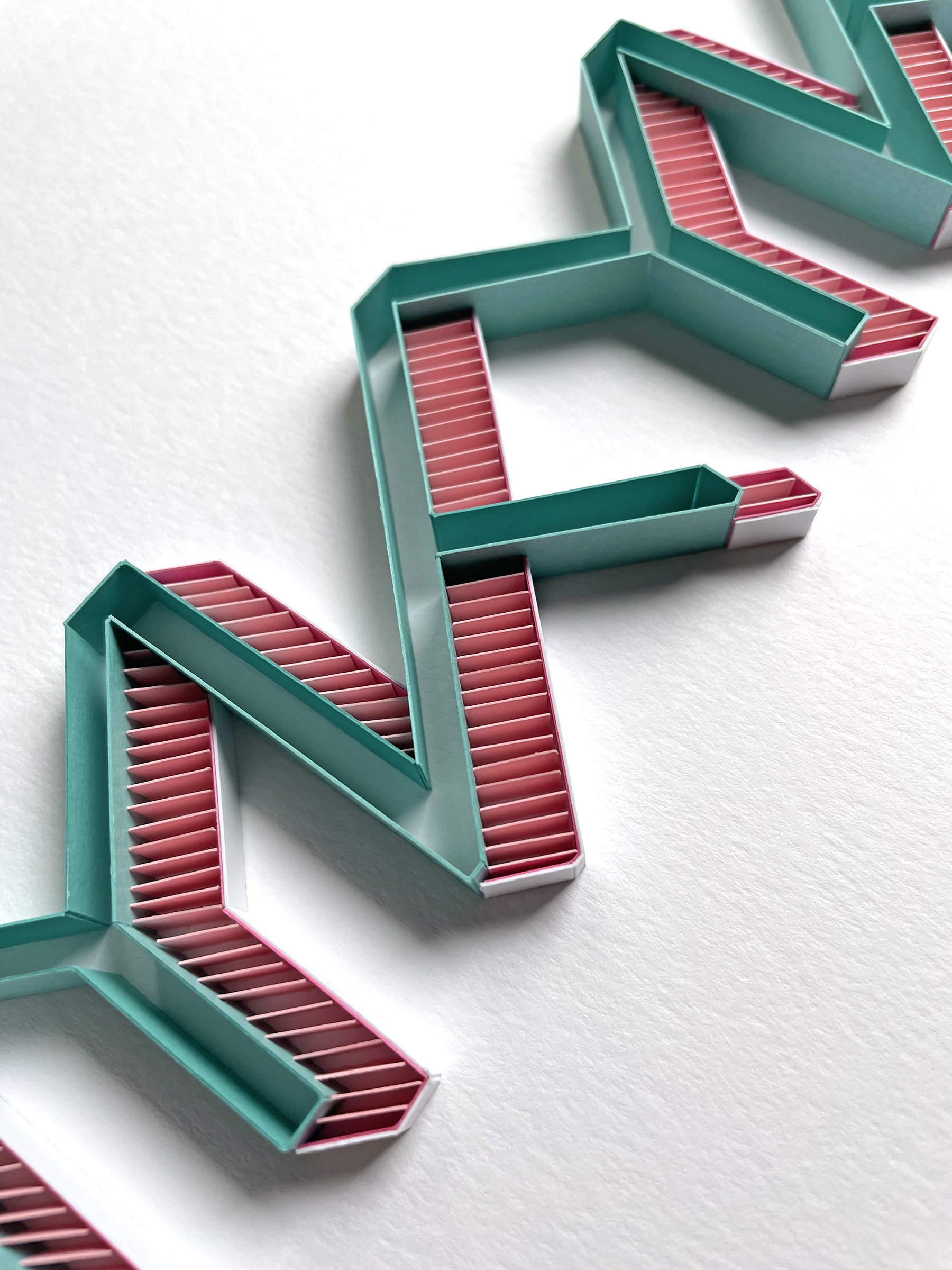 Typography original on-edge paper art - IYKYK acronym detail