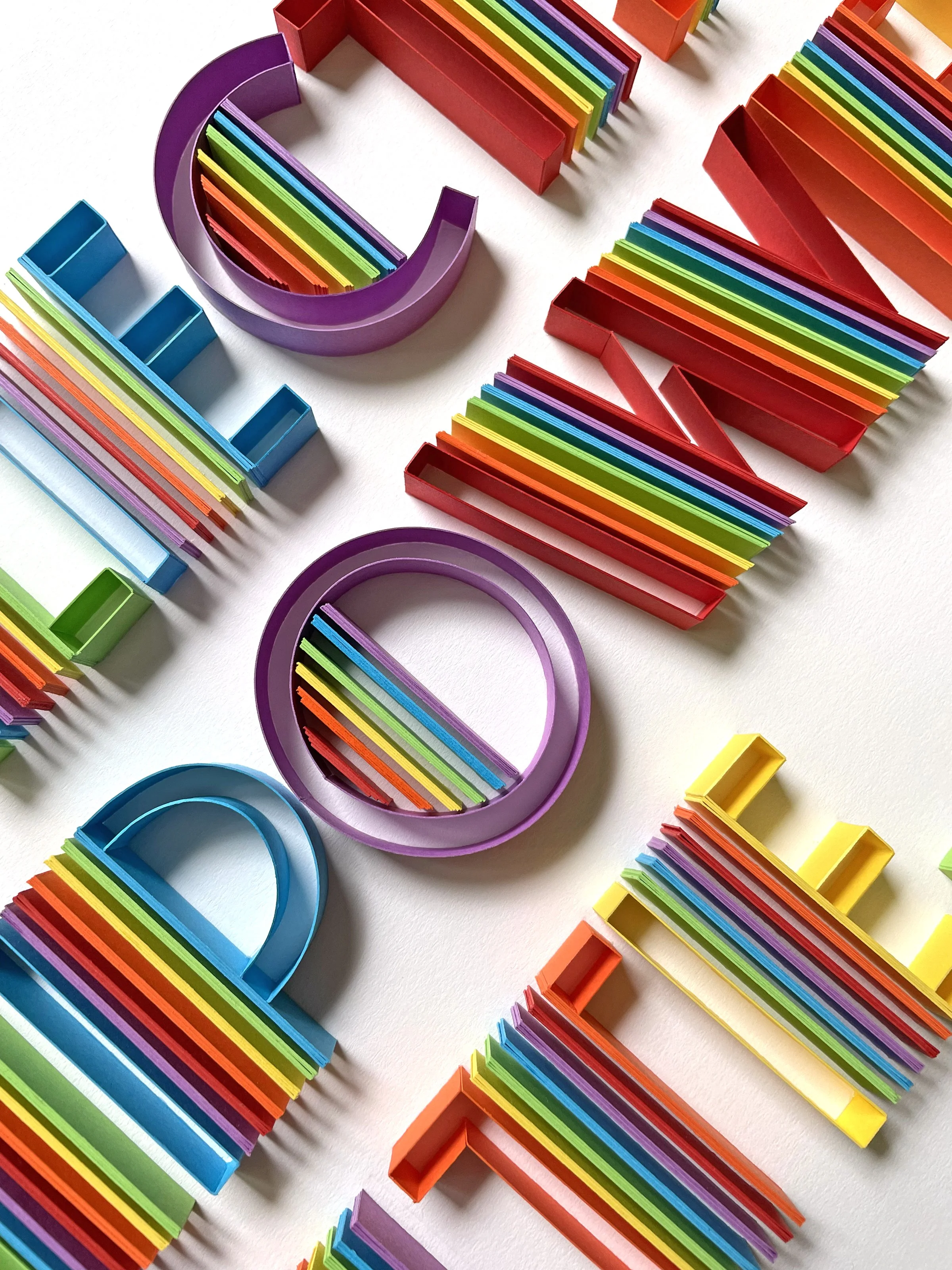 Typography original on-edge paper art - REFLECT. EMPOWER. UNITE. Pride detail